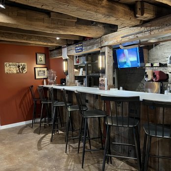 Red Barn Winery - a bar with stools and a flat screen tv - Wineries Near Me - Delmont, Pennsylvania Red Barn Winery - a bar with stools and a flat screen tv - Wineries Near Me - Delmont, Pennsylvania