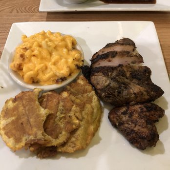 Cutlass Grille - Jerk chicken, macaroni and cheese, and tostones. The chicken has a slow burn, not to spicy, but I enjoy spicy food. Mac and cheese FTW - Caribbean Near Me - Chesapeake, Virginia Cutlass Grille - Jerk chicken, macaroni and cheese, and tostones. The chicken has a slow burn, not to spicy, but I enjoy spicy food. Mac and cheese FTW - Caribbean Near Me - Chesapeake, Virginia