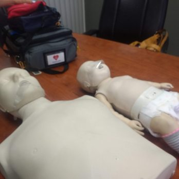 Safety First CPR - Adult and baby with the protective covering and AED. Easy to use. Strength is what you'll need though. - CPR Classes Near Me - Santa Ana, California Safety First CPR - Adult and baby with the protective covering and AED. Easy to use. Strength is what you'll need though. - CPR Classes Near Me - Santa Ana, California