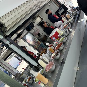 Tacos Fénix - The food cart with all the different toppings - Tacos Near Me - Ensenada, BCN