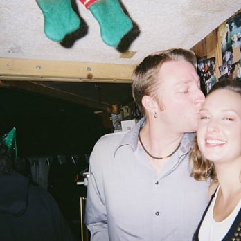 Break Time - a man kissing a woman in a bar - Sports Bars Near Me - Goleta, California