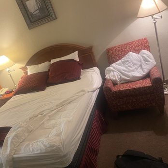 Ramada by Wyndham Kingman - Undone bed and comforter balled up in chair unclean. - Hotels Near Me - Kingman, Arizona Ramada by Wyndham Kingman - Undone bed and comforter balled up in chair unclean. - Hotels Near Me - Kingman, Arizona