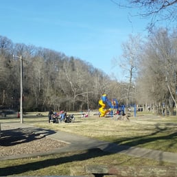 Playgrounds, picnic area and lake in the background.