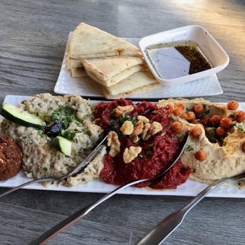 Moussaka Mediterranean Kitchen - Small combo plate with hummus, muhammara, baba ghanoush, a falafel and regular pita - Mediterranean Near Me - San Leandro, California Moussaka Mediterranean Kitchen - Small combo plate with hummus, muhammara, baba ghanoush, a falafel and regular pita - Mediterranean Near Me - San Leandro, California
