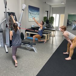 Scend Fitness - Trainer Kimberly McNeil having fun in a partner training session.
