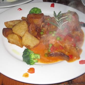 Costa Brava - Conejo a la Cazadora (braised rabbit w/ herbs, tomato, onions, potatoes, carrots & white wine) - Tapas Bars Near Me - San Diego, California Costa Brava - Conejo a la Cazadora (braised rabbit w/ herbs, tomato, onions, potatoes, carrots & white wine) - Tapas Bars Near Me - San Diego, California