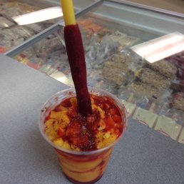 a drink with a stick sticking out of it a drink with a stick sticking out of it