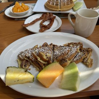 Proino Breakfast Club - Breakfast cinnamon raisin crunch Bach toast with a side of bacon - Breakfast & Brunch Near Me - Largo, Florida Proino Breakfast Club - Breakfast cinnamon raisin crunch Bach toast with a side of bacon - Breakfast & Brunch Near Me - Largo, Florida