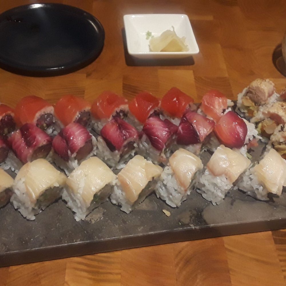 Akira - The only rolls I've ever seen Taro make. This tray had a dragon roll, salmon roll, beet juice marinated tuna roll and a white fish roll - Sushi Bars Near Me - Eugene, Oregon
