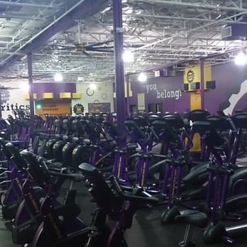 Planet Fitness - View of bikes and elipticals from next to the machines near the dumbell area - Gyms Near Me - Denton, Texas
