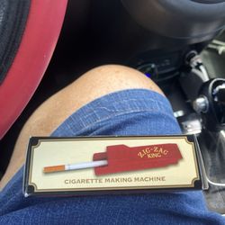 Texas Tobacco - Rolling cigarette machine.