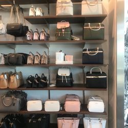 Guess Factory Store - New August handbags.