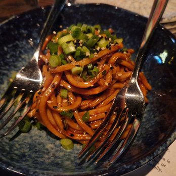 Cafe Tu Tu Tango - Chilled Chili Udon Noodles - spicy soy-chili sauce, scallions, sesame seeds - Tapas/Small Plates Near Me - Orlando, Florida Cafe Tu Tu Tango - Chilled Chili Udon Noodles - spicy soy-chili sauce, scallions, sesame seeds - Tapas/Small Plates Near Me - Orlando, Florida