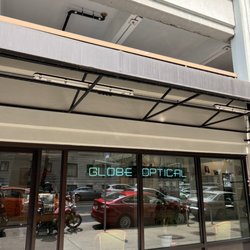 Globe Optical - Found on 5th avenue next to monorail overhead train track. Est 1920?? This Location since 2016