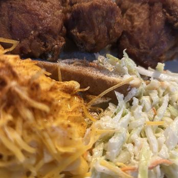 Gus's World Famous Fried Chicken - Mac and cheese with a sprinkle of spice, slaw and 3 dark meat chickens! - Southern Near Me - Houston, Texas Gus's World Famous Fried Chicken - Mac and cheese with a sprinkle of spice, slaw and 3 dark meat chickens! - Southern Near Me - Houston, Texas