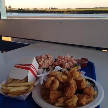 Markey's Lobster Pool - Two lobster rolls, scallops, shrimp, fries, and a side of beautiful view. - Seafood Near Me - Seabrook, New Hampshire Markey's Lobster Pool - Two lobster rolls, scallops, shrimp, fries, and a side of beautiful view. - Seafood Near Me - Seabrook, New Hampshire