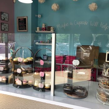 Smallcakes - a display of cupcakes and pastries - Cupcakes Near Me - Huntersville, North Carolina Smallcakes - a display of cupcakes and pastries - Cupcakes Near Me - Huntersville, North Carolina