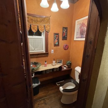 Sfumato Pizzeria - a bathroom with a toilet and sink - Pizza Near Me - Alton, Iowa Sfumato Pizzeria - a bathroom with a toilet and sink - Pizza Near Me - Alton, Iowa