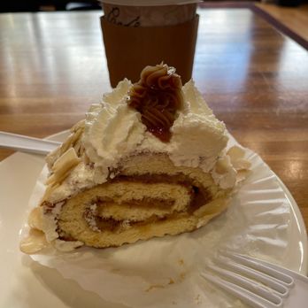 Tentaciones Colombianas - Caramel Columbia's Pastry with cup of coffee and steamed cream. - Bakeries Near Me - Boonton, New Jersey