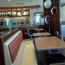 empty tables and chairs in a restaurant