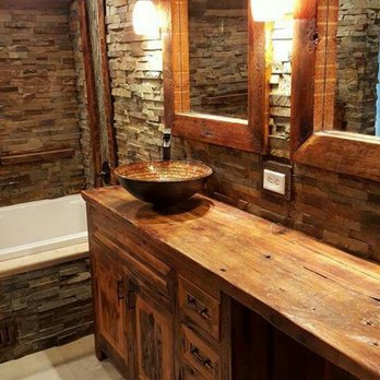 Frame to Finish - a rustic bathroom with stone walls - General Contractors Near Me Frame to Finish - a rustic bathroom with stone walls - General Contractors Near Me
