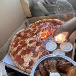 Gino's Real New York Pizza - Pizza & Wings Was So Good & So Fresh. Didn't Even Leave The Parking Lot Yet . #CoraWasTheBest