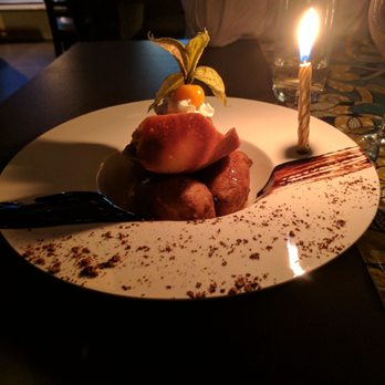Le Virunga - Chocolate mousse sitting in a coconut tuile atop fresh plantain beignets - African Near Me - Montreal, Quebec Le Virunga - Chocolate mousse sitting in a coconut tuile atop fresh plantain beignets - African Near Me - Montreal, Quebec
