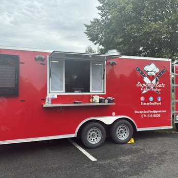 Stacey - a red food truck parked in a parking lot - Food Trucks Near Me Stacey - a red food truck parked in a parking lot - Food Trucks Near Me