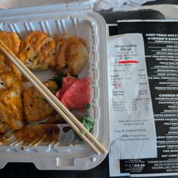 Sushi next to receipt and menu. Sushi next to receipt and menu.