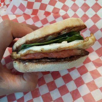 Coal Harbour Cafe - a hand holding a sandwich - Coffee & Tea Near Me - Vancouver, British Columbia Coal Harbour Cafe - a hand holding a sandwich - Coffee & Tea Near Me - Vancouver, British Columbia