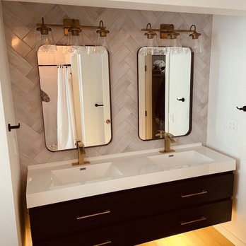 M&P Renovations - Herringbone tile accent wall with a his and hers floating vanity & under mount lighting on a motion switch to tie things together nicely - General Contractors Near Me M&P Renovations - Herringbone tile accent wall with a his and hers floating vanity & under mount lighting on a motion switch to tie things together nicely - General Contractors Near Me