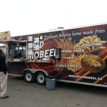 Spud Mobeel - a food truck parked in a parking lot - Food Trucks Near Me Spud Mobeel - a food truck parked in a parking lot - Food Trucks Near Me