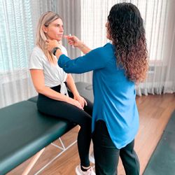 MovementX - Dr. Janine DeBrito, PT, DPT working with a patient with vertigo and dizziness.