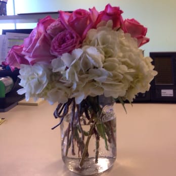 The Plum Dahlia - Roses in a mason jar tied with twine to give a more rustic look. The hipster GF adored it. - Florists Near Me