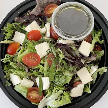 Sliceworks - a salad in a black bowl - Pizza Near Me - Denver, Colorado Sliceworks - a salad in a black bowl - Pizza Near Me - Denver, Colorado