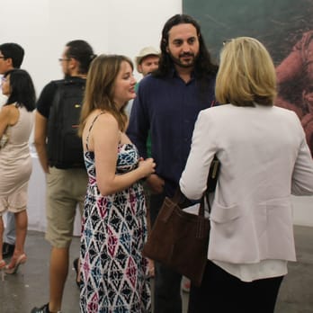 Unix Gallery - Visiters talking with the artist, Alexi Torres (center.) - Art Galleries Near Me - New York, New York Unix Gallery - Visiters talking with the artist, Alexi Torres (center.) - Art Galleries Near Me - New York, New York