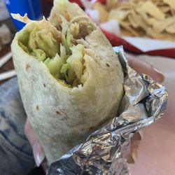 Taco del Sol - Vegan burrito-veggie burrito no dairy refried beans Mexican rice lettuce guacamole chips and salsa