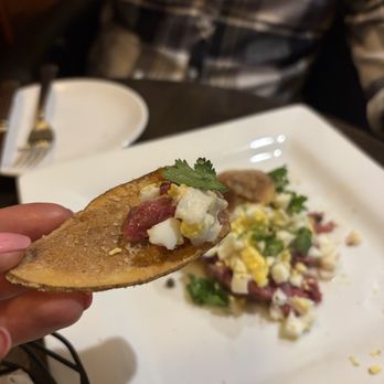 Cask & Cleaver Steakhouse - Flavor packed bite of Steak Tartare. Tender, velvety, crunchy, salty. - Bars Near Me - Mount Vernon, Washington Cask & Cleaver Steakhouse - Flavor packed bite of Steak Tartare. Tender, velvety, crunchy, salty. - Bars Near Me - Mount Vernon, Washington
