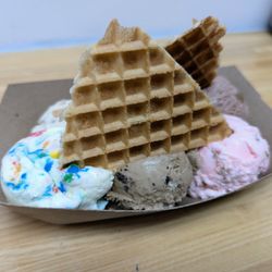 Andia's Ice Cream - Sampler Flight. $7.75. Baklava, Cake Batter, Oreo Latte, Ube, Malted Twix, Rose Pistachio. Topped with 2 waffle wedges.