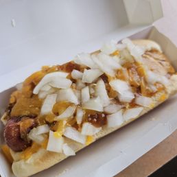 All beef chili cheese dog with shredded cheese and onions. All beef chili cheese dog with shredded cheese and onions.