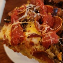 Meat Lovers (Detroit-style Deep Dish) Pizza: Each slice loaded with bacon, sausage, and pepperoni