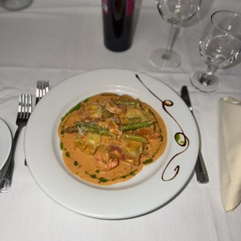 Il Gusto - Homemade flower Ravioli stuffed with spinach and ricotta cheese, topped with shrimp, crabmeat asparagus finished in brandy pink blush sauce. - Italian Near Me - Philadelphia, Pennsylvania Il Gusto - Homemade flower Ravioli stuffed with spinach and ricotta cheese, topped with shrimp, crabmeat asparagus finished in brandy pink blush sauce. - Italian Near Me - Philadelphia, Pennsylvania