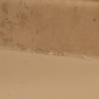 Re-Bath - The grout prior to ReBath repairing the finishing work. - Kitchen & Bath Near Me - Anchorage, Alaska