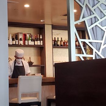 Minamoto Japanese Cuisine - Sushi bar hard at work. This is where you can order the omakase. - Japanese Near Me - Bellevue, Washington