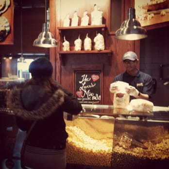 Garrett Popcorn Shops - Ready to order our popcorn. That is the caramel and cheese popcorn ready to go in the main display case. - Popcorn Shops Near Me - Chicago, Illinois