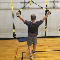 Change Your Body Boot Camp - This is a TRX Y-Raise from a standing split stance.  Got rounded shoulders?  This is one of the antidotes.