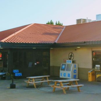 Flying J Travel Center - front of building in the middle than the trucker's entrance coming off of the diesel Island.  tables to talk or have a puff - Gas Stations Near Me - Jackson, Georgia