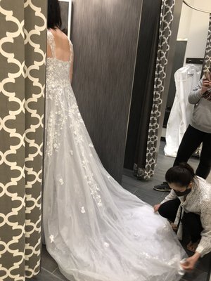 Wedding Dress Alterations - With over 25 years of experience in providing top-notch wedding dress alteration services, we take pride in making every bride's dream dress fit perfectly for their special day. Our team of skilled experienced seamstresses will ensure your dress not only fits flawlessly but also enhance its unique features. We offer complimentary fitting estimate, so you can be confident about the alterations. Call us now to book a consultation.