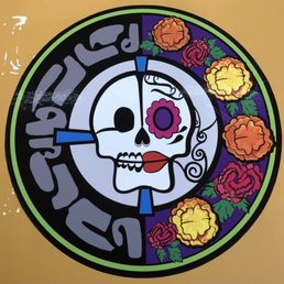 a mexican skull and flowers
