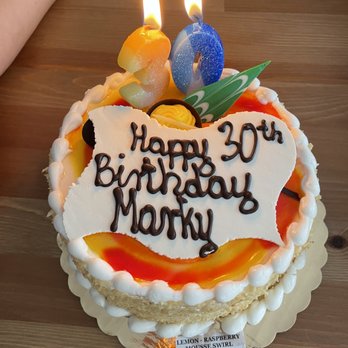 Oak Mill Bakery - a birthday cake with candles - Bakeries Near Me - Harwood Heights, Illinois